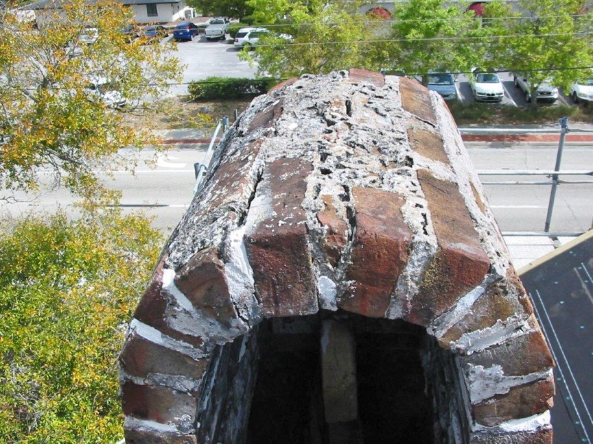 North side chimney deteriorated mortar on dome cap.
