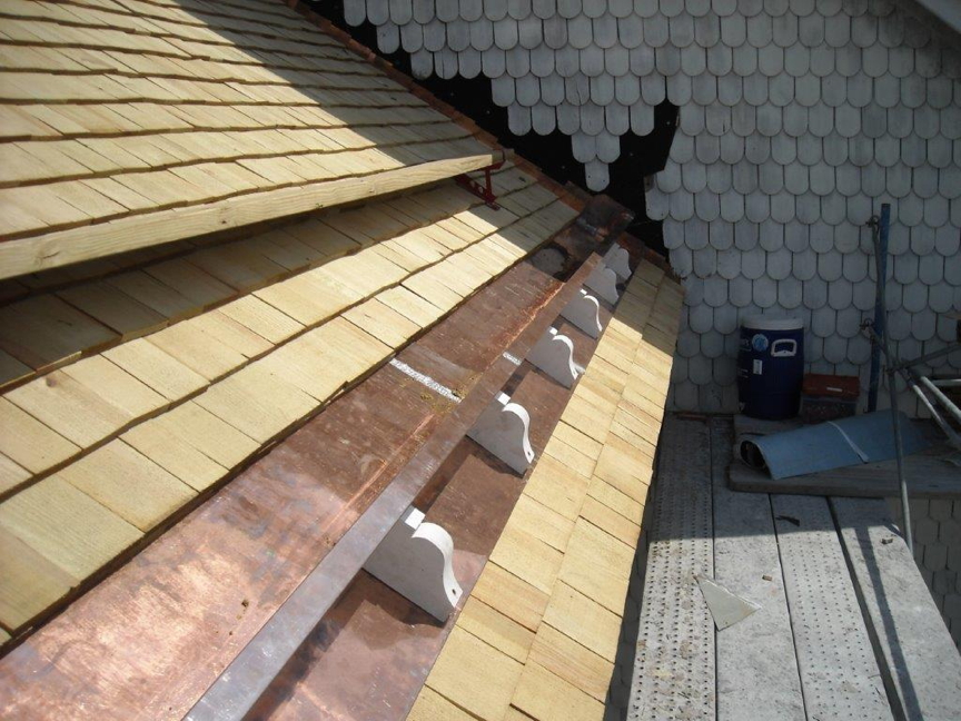 Stop gutters installed under new heart pine shingles.